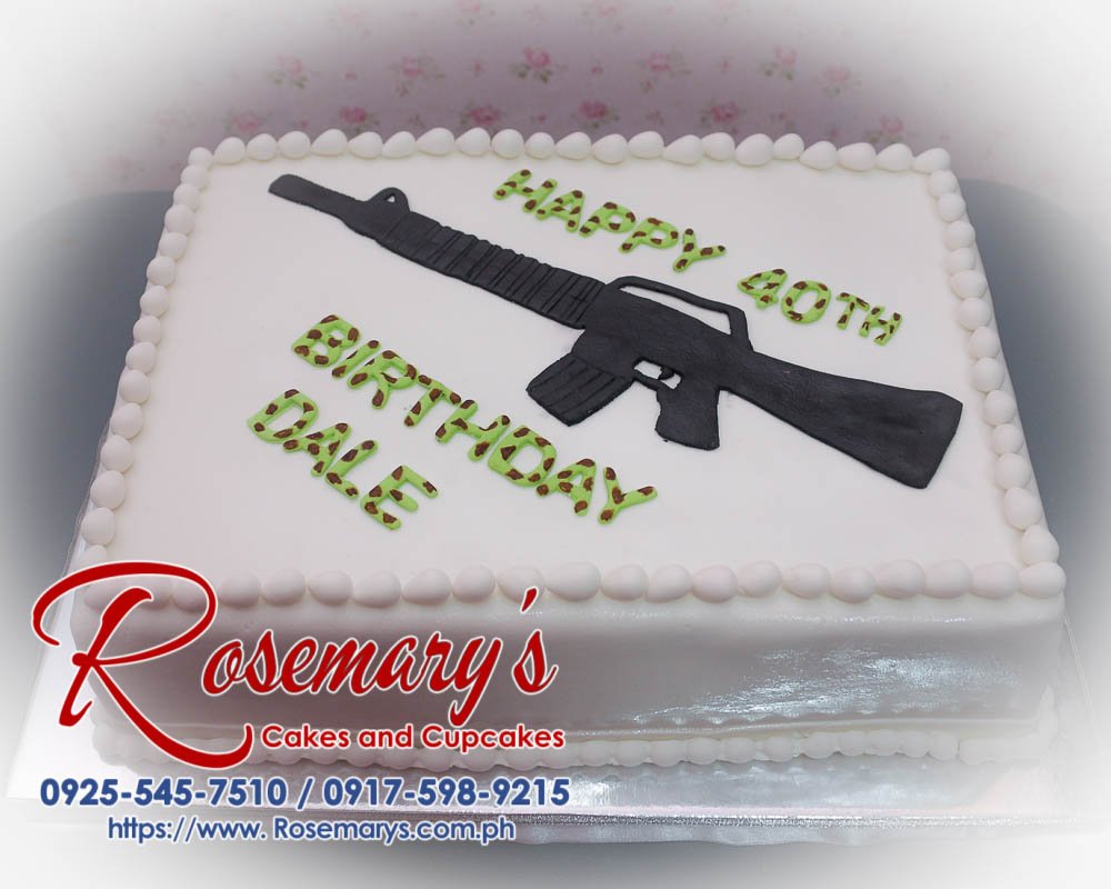 Delicious 1-layer camouflage cake featuring an M16 gun design, perfect for themed celebrations. Order from Rosemary's Cakes: 0917-598-9215.