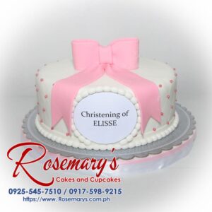 Delectable one-layer pink and white christening cake adorned with a satin ribbon. Perfect for celebrating this special occasion. Order yours from Rosemary's Cakes: 0925-545-7510