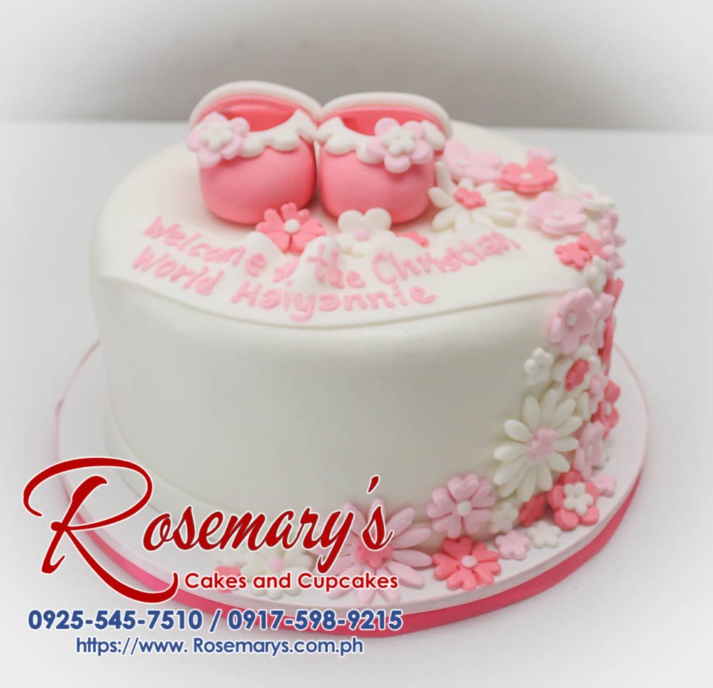 Beautiful single-layer pink and white christening cake adorned with delicate fondant baby shoes. Perfect for celebrating a special baptism! Order yours from Rosemary's Cakes: 0917-598-9215