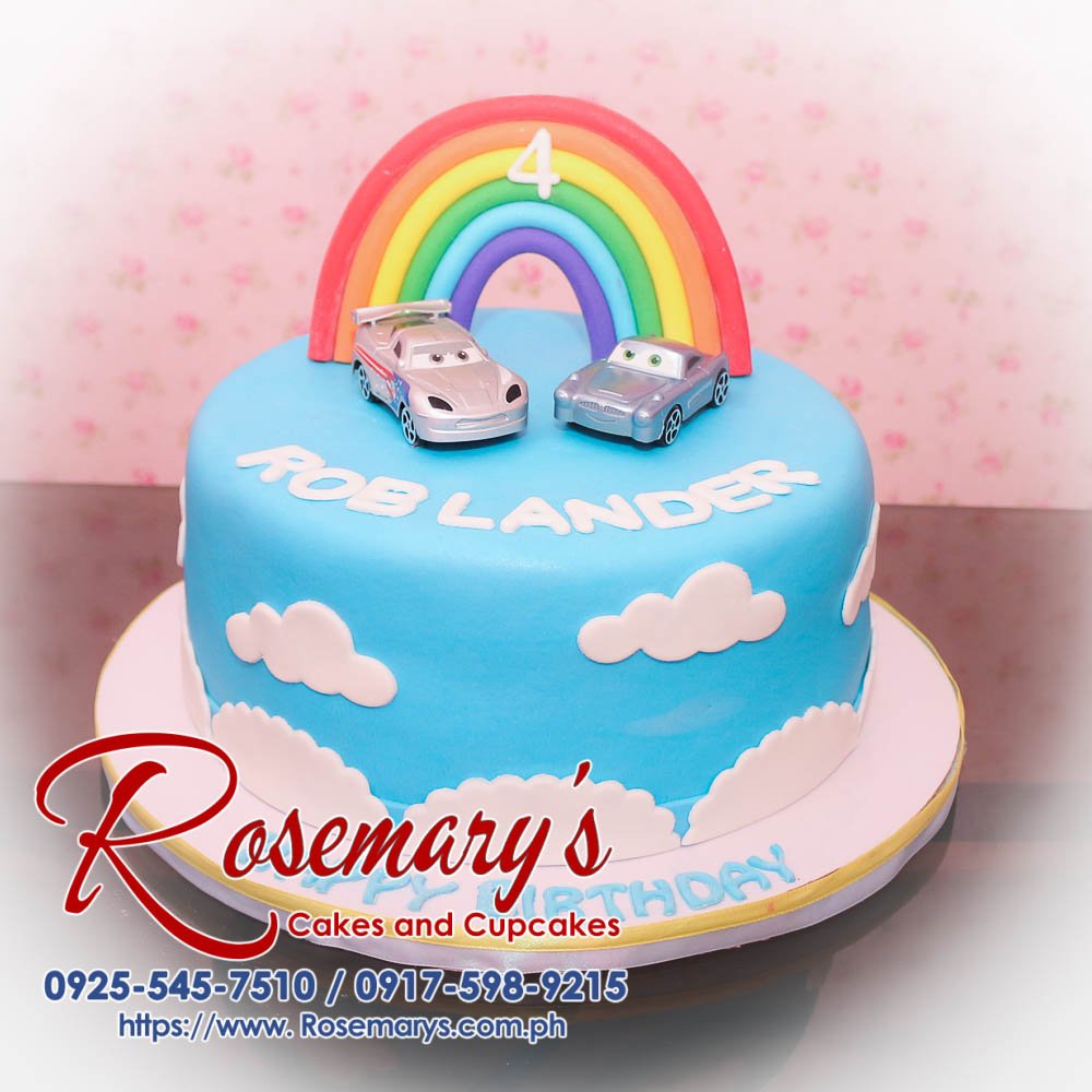 1 Layer Cake for Rob Lander Delicious 1 layer blue birthday cake with white clouds and rainbow accents. Perfect for any celebration. Rosemary's Cakes, 0917-598-9215.
