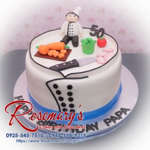 Delicious 1 layer chef-themed cake in white fondant, perfect for celebrations. From Rosemary's Cakes, call 0925-545-7510.