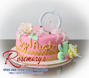 Delicious one-layer pink dreamcatcher cake with intricate icing details. Order yours from Rosemary's Cakes! Call 0917-598-9215.