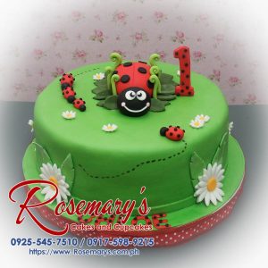 1 layer ladybug themed cake in vibrant red and green, decorated with playful ladybugs. Order from Rosemary's Cakes: 0925-545-7510.