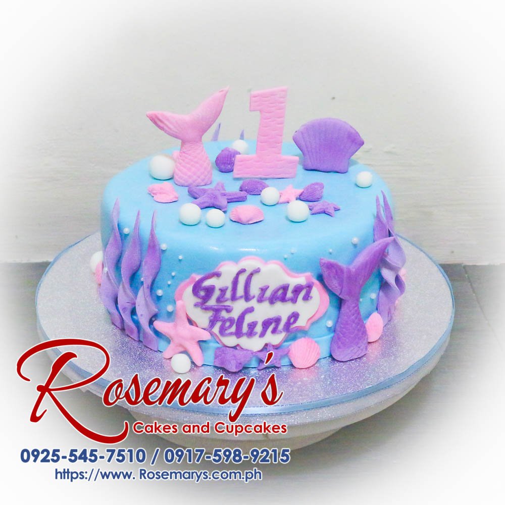 1 Layer Mermaid Themed Cake for Gillian Feline’s 1st Birthday Delicious 1 layer mermaid themed cake in blue and pastel purple, perfect for birthdays. Order from Rosemary's Cakes at 0925-545-7510.