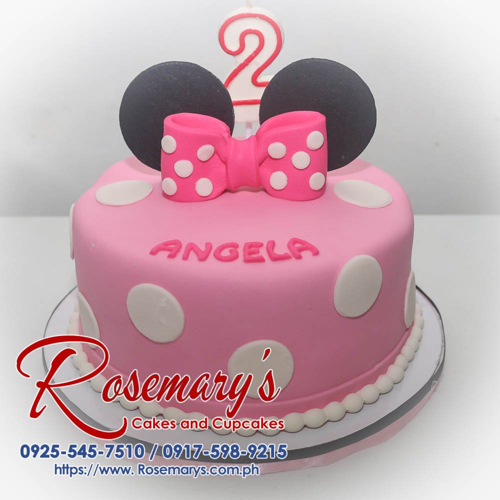 Delicious 1-layer pink Minnie Mouse cake with white icing and edible accents. Order your custom themed cake from Rosemary's Cakes! Call 0925-545-7510.