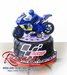 Delicious one-layer MotoGP birthday cake, featuring intricate frosting details and a checkered flag design. Order your custom cake from Rosemary's Cakes: 0925-545-7510