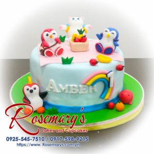Delicious 1-layer blue penguin themed cake with pastel rainbow accents by Rosemary's Cakes. Contact: 0925-545-7510.