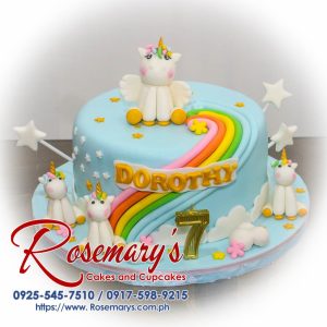 Delicious 1-layer blue cake with a whimsical unicorn theme. Features a vibrant rainbow and edible decorations. Order your own custom cake from Rosemary's Cakes! Call 0925-545-7510.