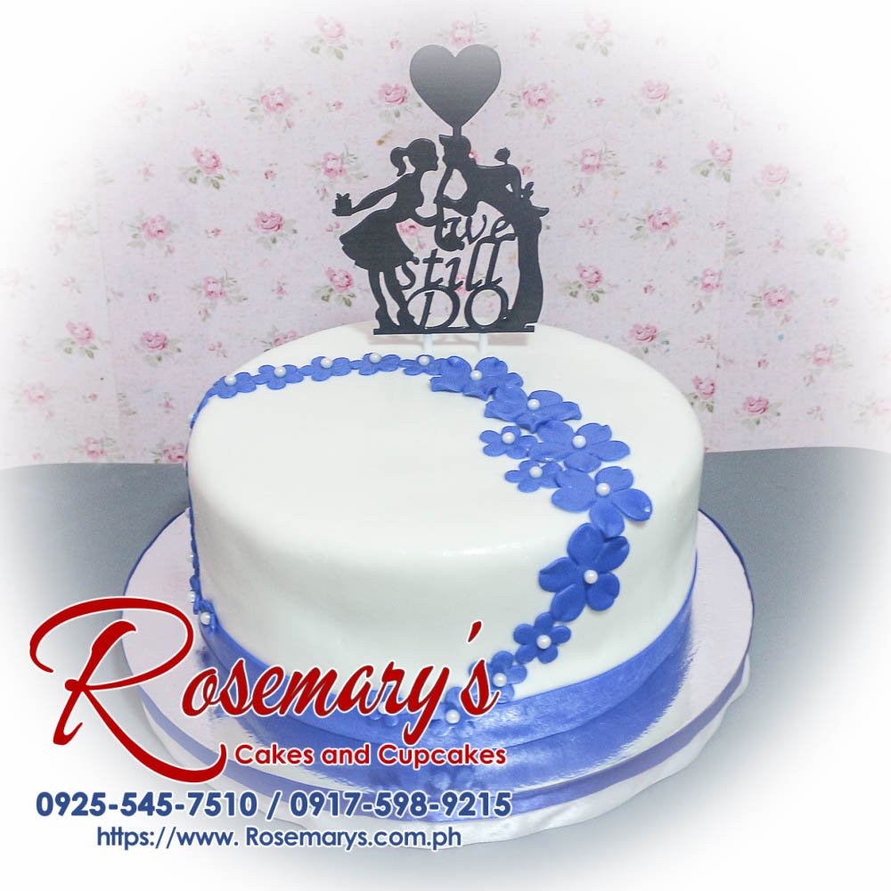 1 Layer White and Blue Wedding Cake Elegant 1 layer white and blue wedding cake adorned with a 3D printed topper. Crafted by Rosemary's Cakes, call 0925-545-7510.