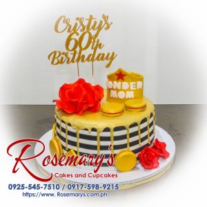 Delicious one-layer "Wonder Mom" cake with 3D printed details and golden accents. Order yours from Rosemary's Cakes! Call 0917-598-9215.