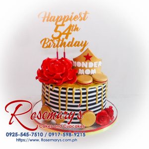 Delicious 1 layer Wonder Woman themed drip cake with gold accents, macaron decorations, by Rosemary's Cakes. Contact: 0917-598-9215.