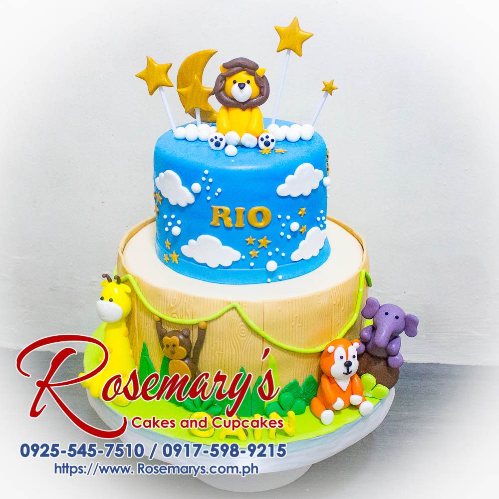2 Layer Animal Safari Themed Cake for Rio Cain Two-layer chocolate cake decorated with fondant animals in a lush jungle scene. Perfect for any wild celebration! Rosemary's Cakes 0925-545-7510.