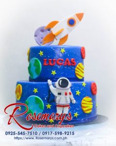 Delicious 2 layer astronaut themed cake in blue, featuring space elements. Order from Rosemary's Cakes at 0917-598-9215.