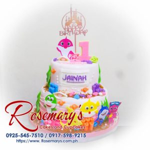 Delicious 2 layer Baby Shark themed cake from Rosemary's Cakes, perfect for celebrations. Contact: 0925-545-7510.