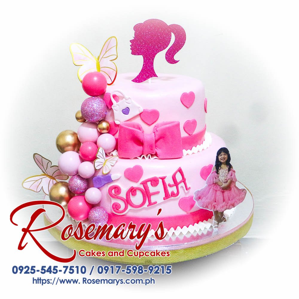 Delicious, two-layer Barbie themed cake in pink, adorned with vibrant decorations. Order from Rosemary's Cakes, 0925-545-7510.