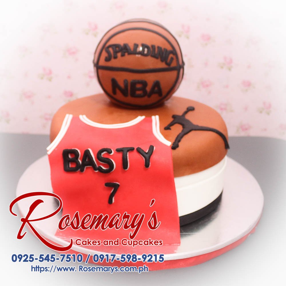 Delicious 2 layer basketball themed cake with red and brown designs, perfect for NBA fans. Order from Rosemary's Cakes at 0917-598-9215.