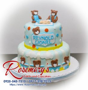 Adorable two-tier blue cake adorned with cute teddy bears and fluffy white clouds. Rosemary's Cakes | 0925-545-7510