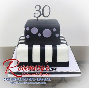 Delicious two-layer black and white square cake with a custom 3D printed topper. Order your unique celebration cakes from Rosemary's Cakes: 0925-545-7510