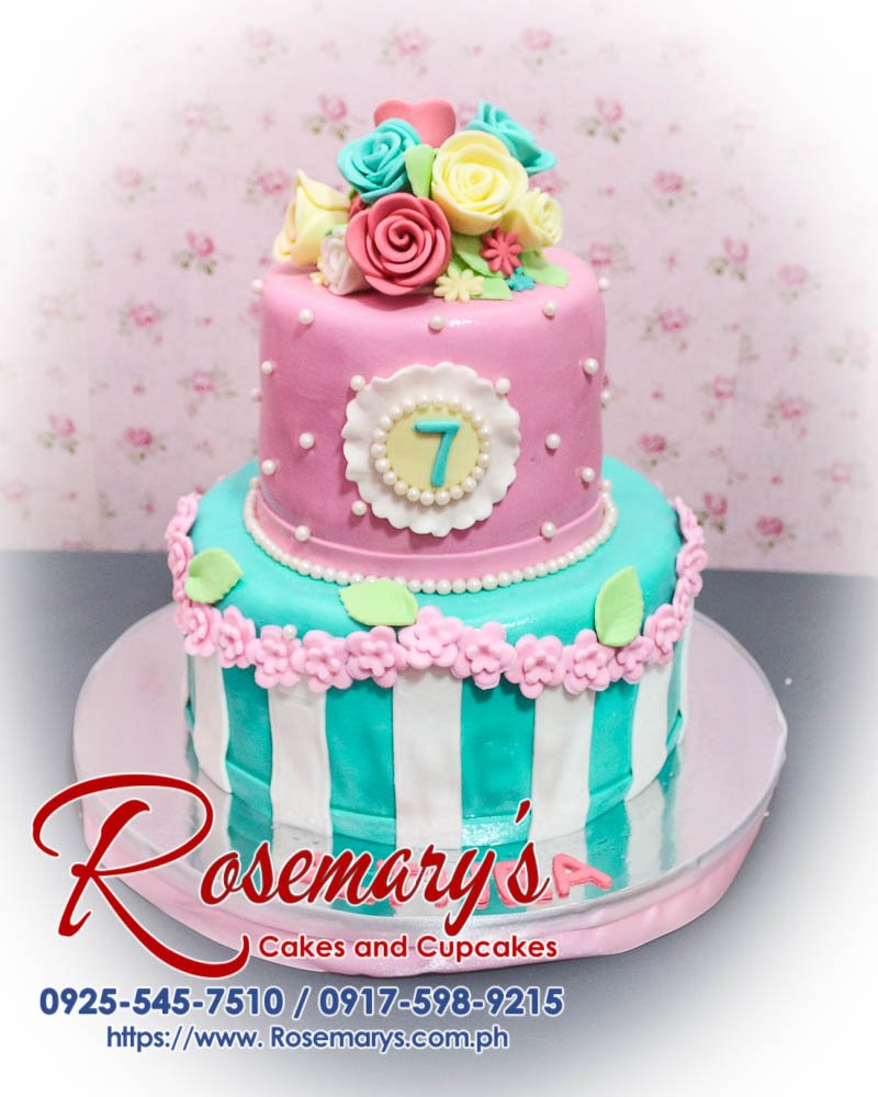 Delicious 2 layer blue and pink flower themed cake from Rosemary's Cakes, perfect for any celebration. Contact 0917-598-9215.