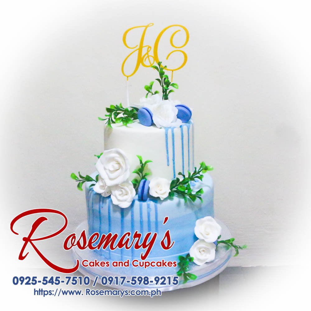 Elegant 2-layer blue and white wedding cake with a custom 3D printed topper by Rosemary's Cakes. Contact: 0925-545-7510.