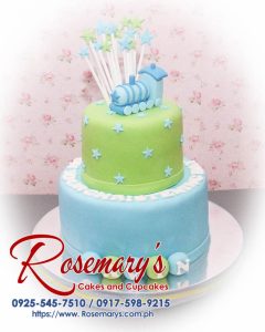 Delicious 2 layer blue and green themed cake featuring a train design for a baptismal celebration. Order from Rosemary's Cakes: 0925-545-7510.
