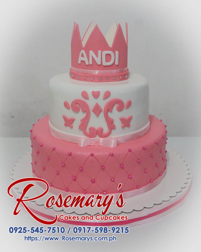 Two-tier pink cake adorned with princess details. Delicious and perfect for any celebration! Rosemary's Cakes: 0925-545-7510