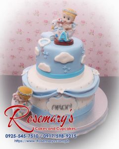 Delicious 2 layer baptismal cake from Rosemary's Cakes, featuring blue clouds and a charming design. Call 0925-545-7510.
