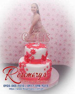 Two-layer pink themed cake adorned with fresh flowers, perfect for an 18th birthday celebration by Rosemary's Cakes. Contact: 0917-598-9215.