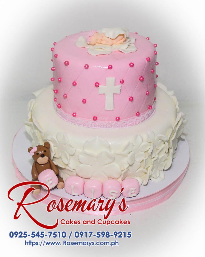 Delicious two-tier pink and white cake adorned with a cute bear perfect for christenings. Order yours from Rosemary's Cakes: 0925-545-7510.