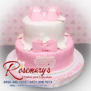 Delicious 2 layer pink cake with ribbon decor, perfect for baptismal or christening celebrations. Rosemary's Cakes, 0917-598-9215.