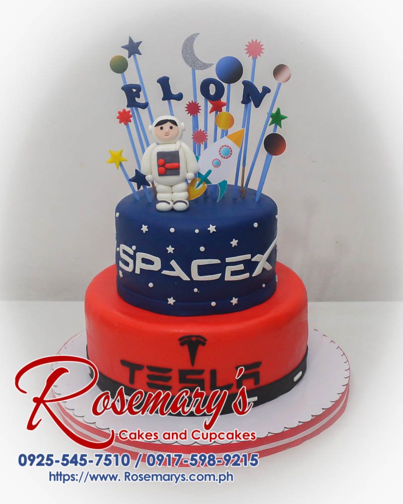 Two-tiered chocolate cake adorned with fondant stars and rockets, perfect for a space enthusiast. By Rosemary's Cakes | 0925-545-7510