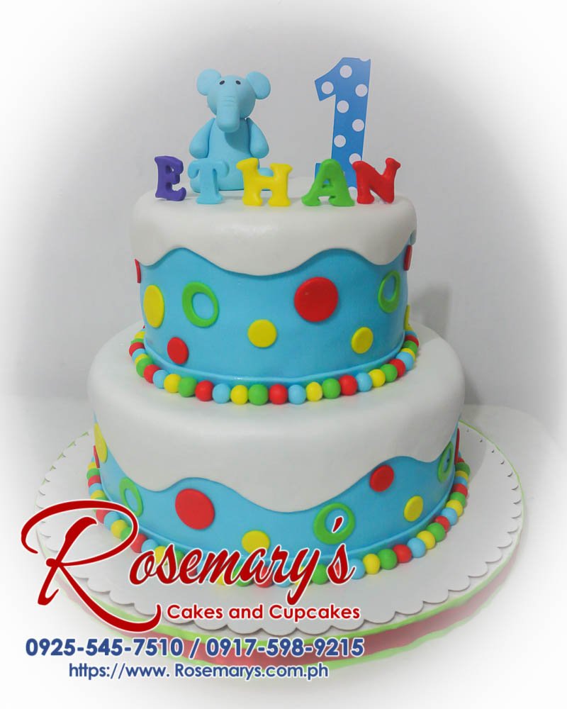 2 Layer Cake for Ethan’s 1st Birthday Two-tier blue birthday cake adorned with a fondant elephant. Delicious and perfect for celebrations! Rosemary's Cakes: 0925-545-7510