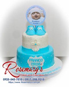 Two-layer blue and white themed christening cake with delicate floral decorations. Deliciously crafted by Rosemary's Cakes | Call 0917-598-9215.