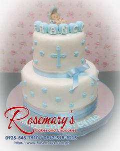 Two-layer blue christening cake with intricate decorations, perfect for baptism celebrations. Order from Rosemary's Cakes at 0917-598-9215.