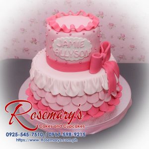 Delicious 2 layer pink cake with ribbon accents, perfect for any celebration. From Rosemary's Cakes, call 0925-545-7510.