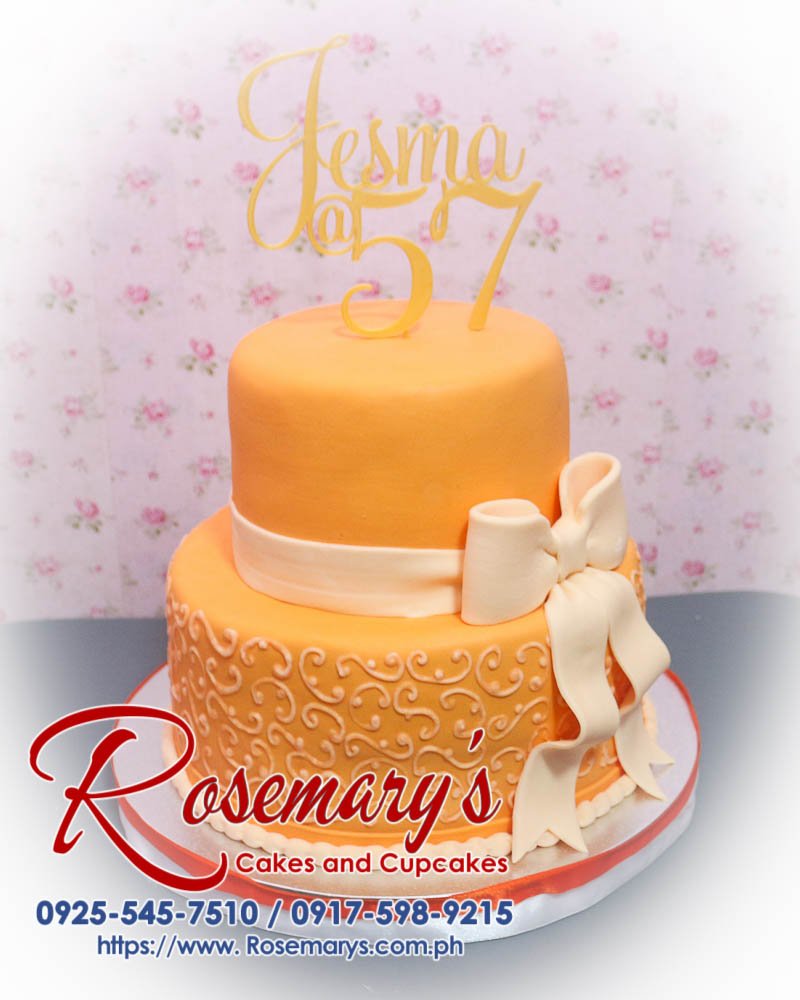 Delicious 2-layer cake with peach accents, 3D printed topper, and elegant ribbon from Rosemary's Cakes. Contact: 0917-598-9215.