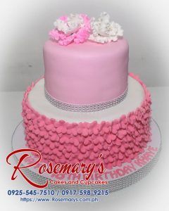 Delicious two-layer pink birthday cake with intricate floral design. Order yours from Rosemary's Cakes! Call 0917-598-9215.