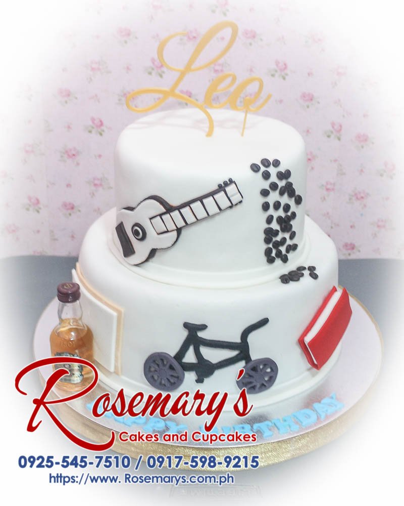 Delicious 2 layer cake from Rosemary's Cakes, featuring a white finish and a 3D printed bicycle topper. Contact 0917-598-9215.