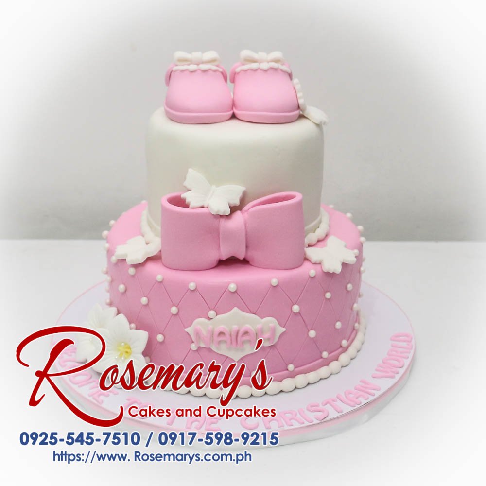 Delicious 2-layer pink cake with delicate floral decorations, perfect for a baptism or christening. Order yours from Rosemary's Cakes: 0917-598-9215.