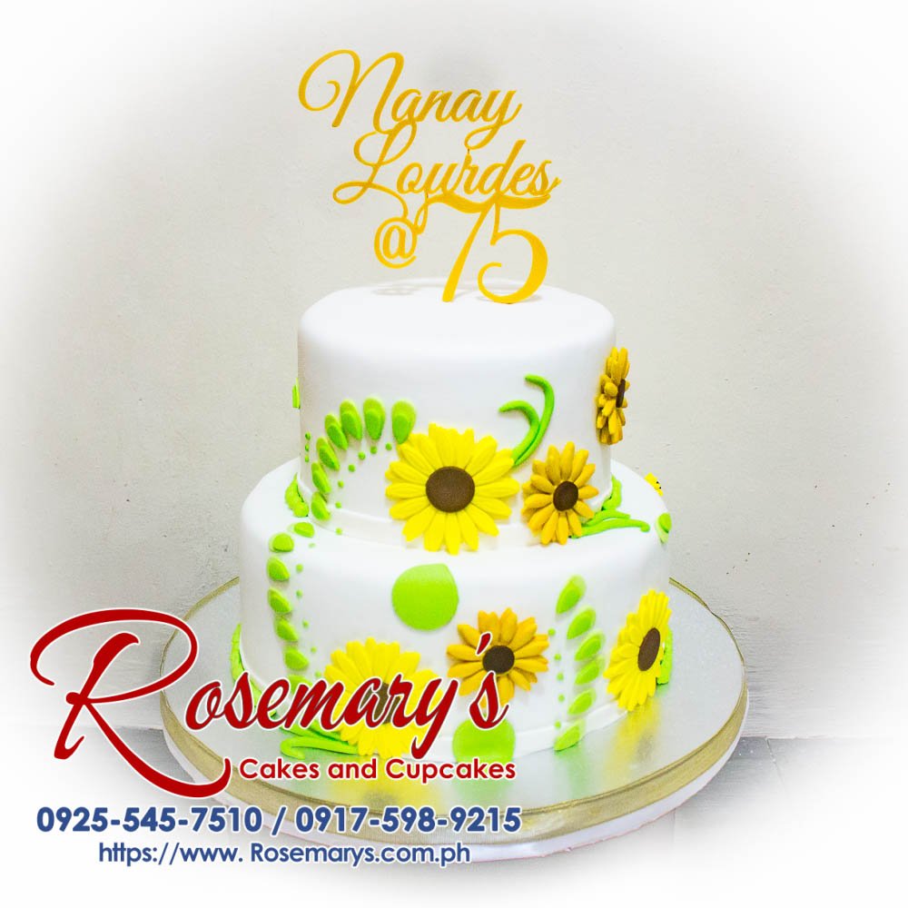 Two-layer vanilla cake adorned with vibrant 3D-printed sunflowers, perfect for birthdays and celebrations. Order yours from Rosemary's Cakes! Call 0917-598-9215.