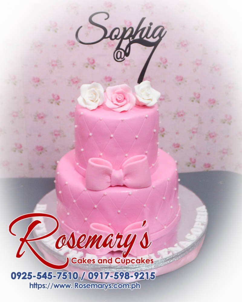 Delicious 2-layer pink cake with a 3D printed topper and elegant ribbon, crafted by Rosemary's Cakes. Contact: 0917-598-9215.
