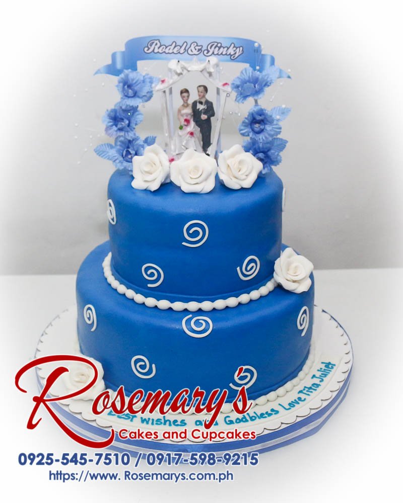 Elegant two-tier blue wedding cake with delicate frosting details. Made by Rosemary's Cakes | Call 0925-545-7510.