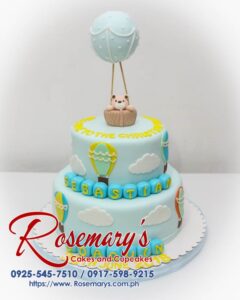 Two-tier christening cake with adorable fondant bear topper. Delicious and perfect for celebrating special occasions. Rosemary's Cakes: 0917-598-9215