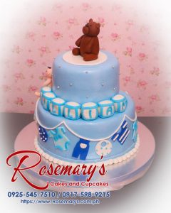 Two-layer blue christening cake featuring fondant baby and teddy bear, perfect for special celebrations. Rosemary's Cakes, 0917-598-9215.
