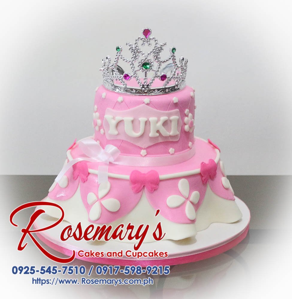 Delicious 2-tier pink birthday cake adorned with a sparkling crown. Perfect for princess-themed celebrations. Order yours from Rosemary's Cakes: 0917-598-9215
