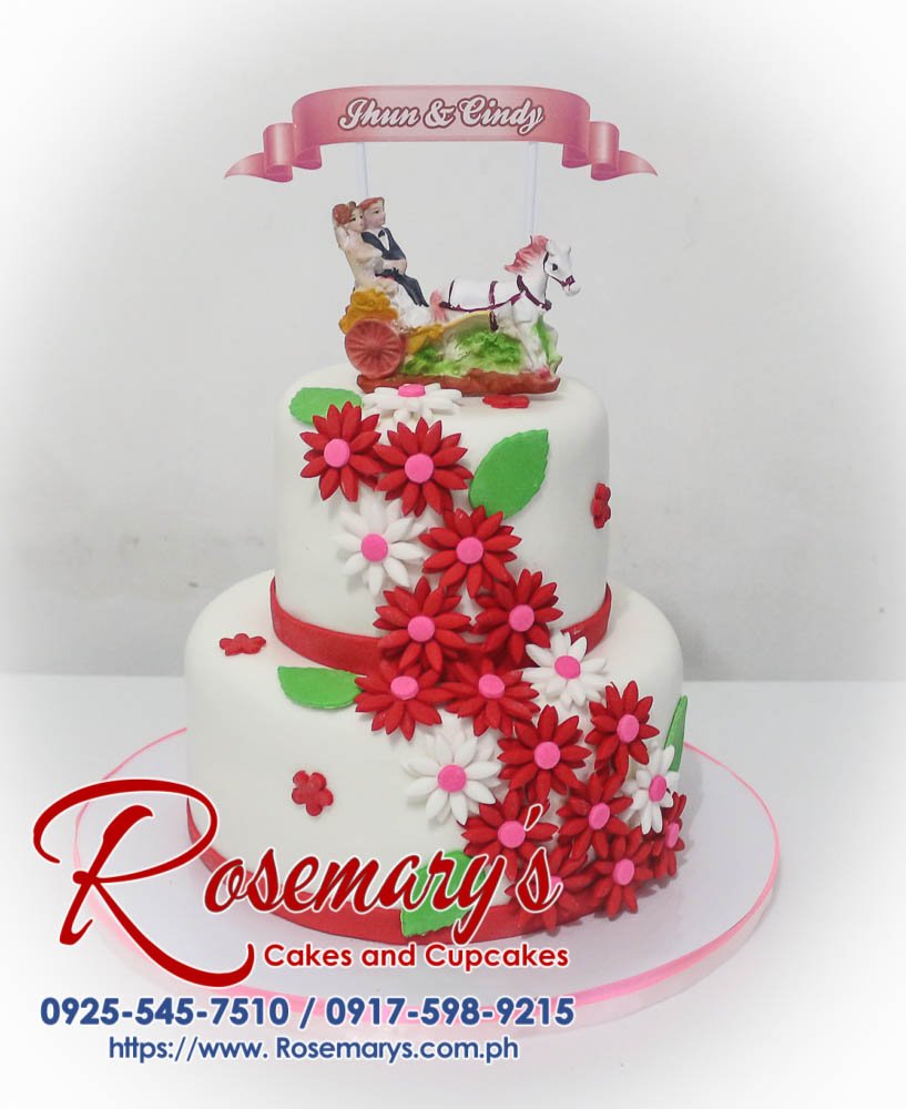 Elegant two-tier wedding cake adorned with delicate red roses. Rosemary's Cakes | 0917-598-9215