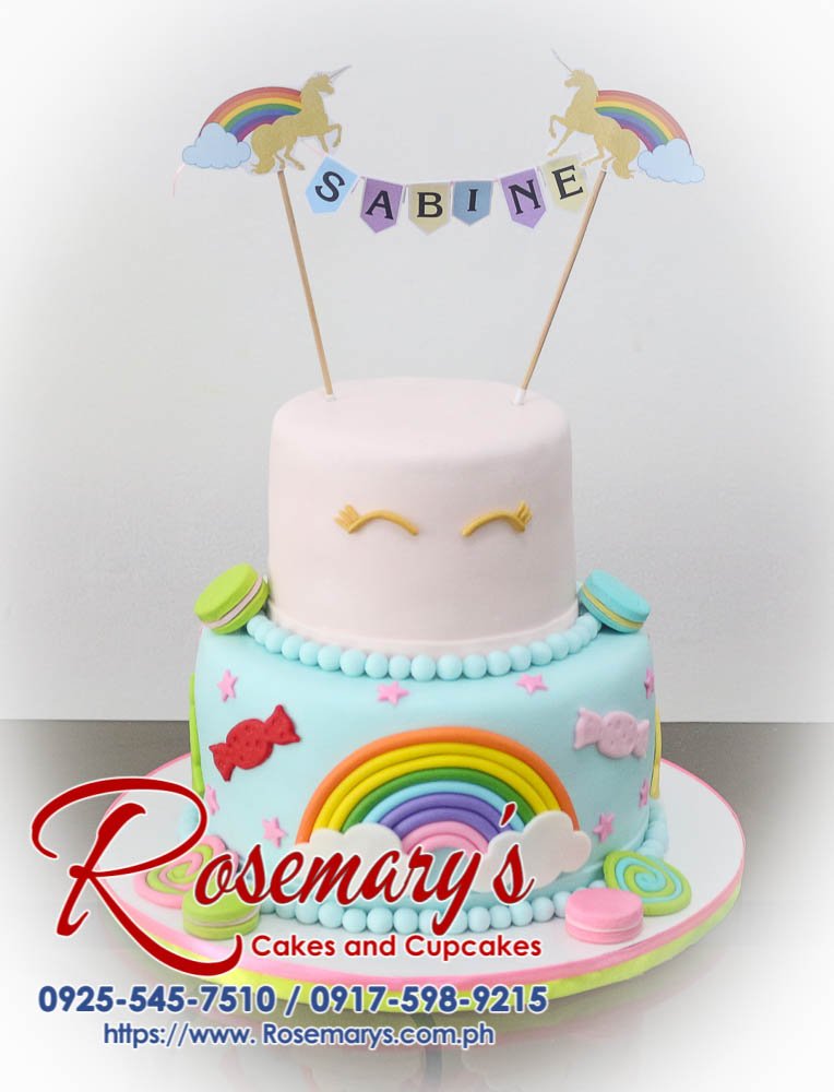 Two-tier pastel rainbow cake decorated with candy land inspired details. Order your custom cakes from Rosemary's Cakes: 0917-598-9215.