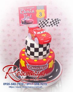 Delicious 2 layer Cars themed cake featuring Lightning McQueen in vibrant red by Rosemary's Cakes. Contact: 0925-545-7510.