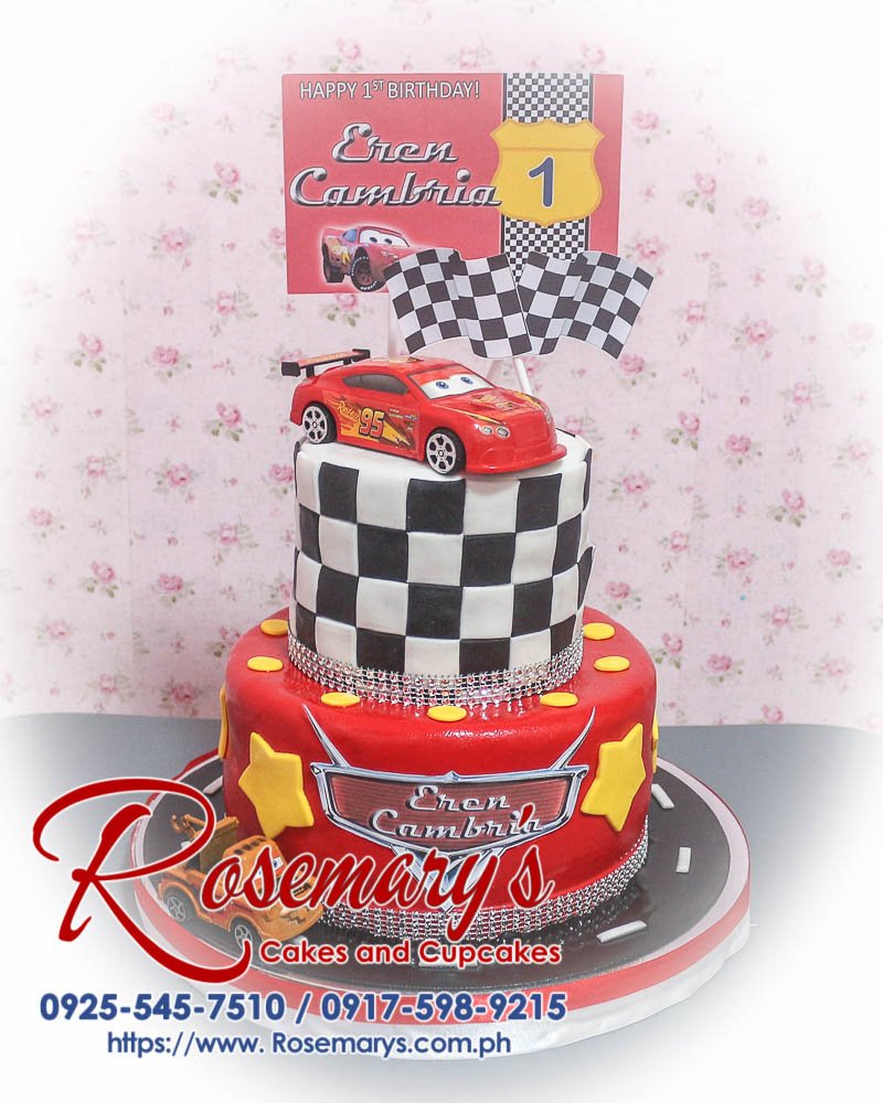 2 Layer Cars Themed Cake for Eren Cambria Delicious 2 layer cars themed cake in black and red, beautifully decorated with white accents. From Rosemary's Cakes, call 0925-545-7510.