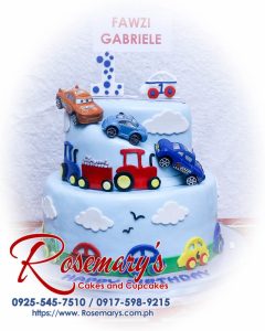 Delicious 2 layer Cars themed cake decorated with vibrant colors and intricate details by Rosemary's Cakes. Call 0917-598-9215.